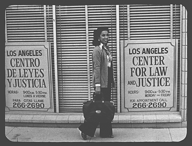 old image of woman in front of Survivor Justice Center office, previously called Los Angeles Center for Law and Justice